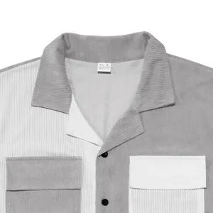 Detailed shot of a men's color-block corduroy shirt showing collar and texture