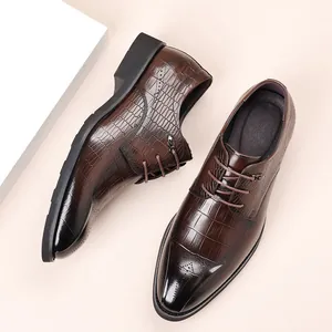 Men's brown crocodile embossed leather dress shoes with brogue details for weddings