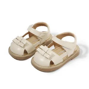 Toddler girl cream sandals with bow decor for first walking steps