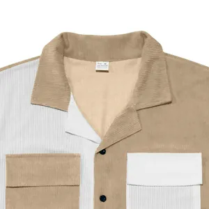 Detailed view of a men's color-block corduroy short-sleeve shirt with a camp collar.
