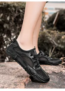 Heren casual zwarte leren mesh sneakers met ademend ontwerp en octopus tractiezool voor buiten