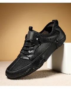 Ademende zwarte leren en mesh heren sneakers met een stevige octopus rubberen zool