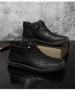 Hand-stitched black leather Martin boots with durable rubber sole detail.