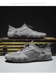 Detaillierte Seitenansicht grauer Leder-Mesh-Freizeitschuhe mit einzigartiger Oktopus-Sohle