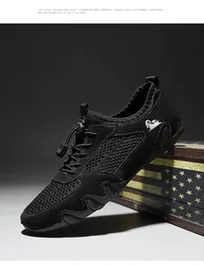 Detailansicht eines schwarzen Herren-Mesh-Sportschuhs mit markanter Oktopus-Sohle
