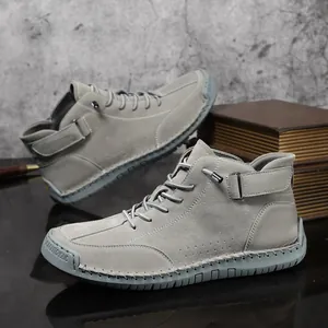 Hand-stitched grey men's high-top casual Martens boots with non-slip rubber soles.
