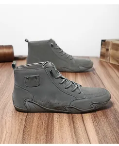Zijaanzicht grijze hoge herenschoenen met unieke octopus-stijl zool ontwerp