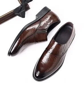 Detailed view of elegant brown leather business formal loafers for stylish modern men