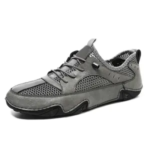 Ademende grijze heren sneakers van leer met mesh panelen en octopus zool ontwerp