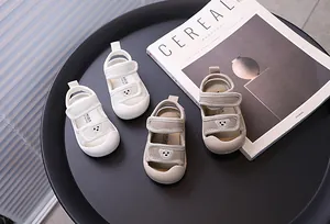 Close-up of breathable mesh baby sandals with cute bear patches and soft non-slip soles