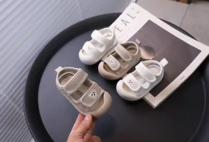 Detail of breathable mesh baby sandals with bear pattern and soft sole
