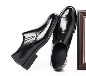 Side profile view of elegant black patent leather men's business shoes for formal use