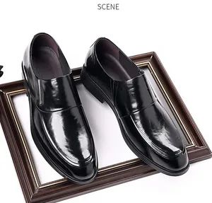 Elegant black leather slip-on dress shoes for men, displayed on a classic frame