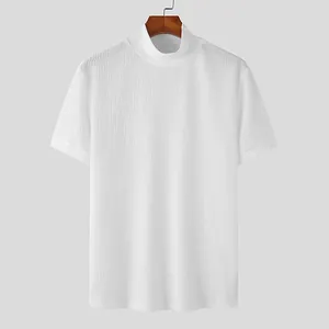 Close-up of white short-sleeved mock neck knit tee with water ripple texture