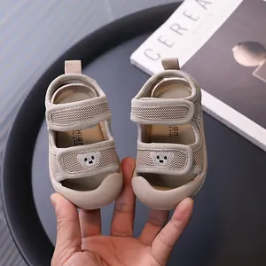 Breathable beige mesh baby sandals with protective closed toe and cute bear detail
