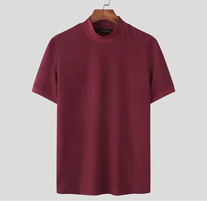 Detailed view of wine red men's mock neck knit t-shirt with premium water ripple texture