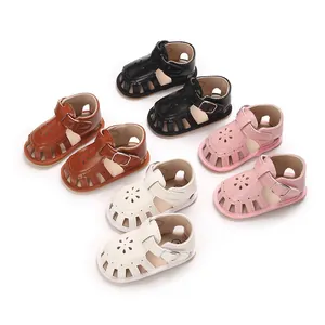 Collection of soft-soled baby girl sandals in black, brown, white, and pink colors