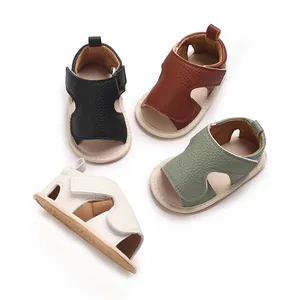 Detailed macro view showing four colors of soft sole baby sandals with velcro straps