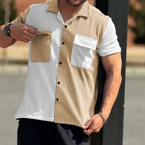 Detail view of men's color block corduroy short sleeve shirt with button closure