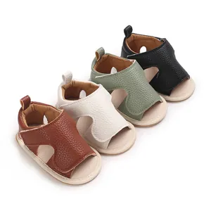 Detailed macro view of four colorful baby leather walking sandals featuring soft rubber soles