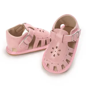 Detailed view of pink baby girl sandals with flower cutout design and soft sole