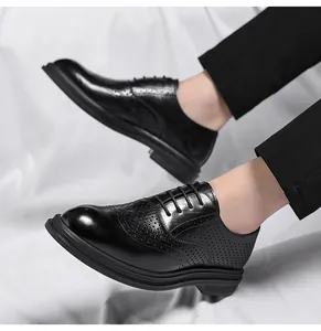 Close-up of black leather Brogue shoes with hollow breathable holes and thick soles