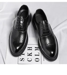 Detailed view of black men's brogue shoes featuring elegant carved wingtip patterns and laces.