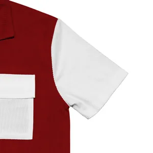Detail view of a men's color-block corduroy shirt showing red and white fabric texture.