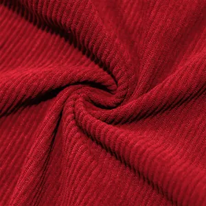 Detailed close-up of premium red corduroy fabric texture for men's casual beach shirt