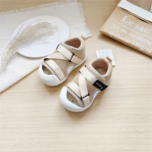 Overhead detail view of beige breathable mesh baby walking sandals with closed toe