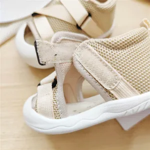 Detail view of breathable mesh baby sandals with soft sole and Velcro closure
