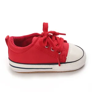 Red baby canvas sneakers with soft sole and white toe cap for 0-1 year old infants