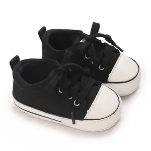 Classic black and white baby canvas sneakers with soft soles for 0-1 year old walking