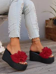Detailed view of women's red floral platform wedge sandals for trendy summer casual wear