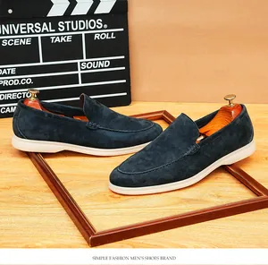 Premium dark blue suede loafers for men with soft white soles and comfortable slip-on design