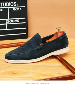 Premium navy blue suede men's slip-on loafers with flexible white comfort soles