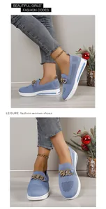 Macro view of light blue mesh slip-on shoes with decorative chunky gold chain