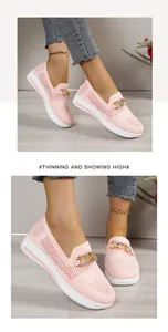 Detailed view of pink breathable knit loafers featuring a stylish gold chain and wedge sole