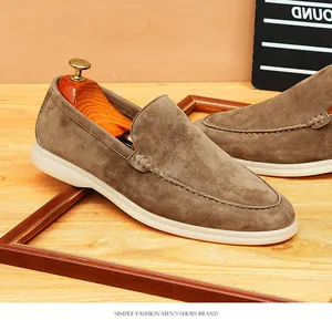 Macro shot showing the fine suede texture and hand-stitched details of men's loafers.