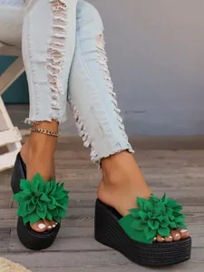 Macro detail of green floral wedge platform sandals with comfortable thick sole