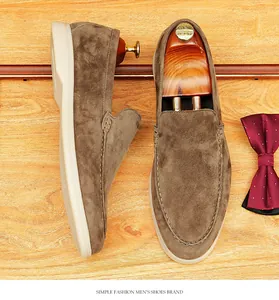 Detailed view of premium brown suede men's slip-on loafers with a soft rubber sole