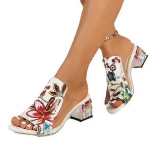 Elegant women's floral print block heel sandals with colorful rhinestone heel details.