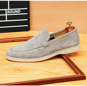 Detailed macro view of premium grey suede loafers with breathable soft soles for men