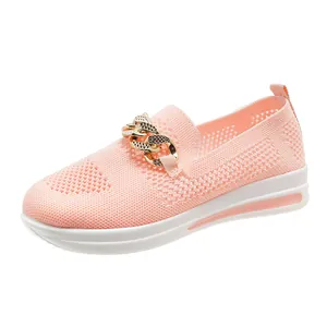 Pink breathable fly-knit slip-on shoes for women featuring a stylish gold chain detail
