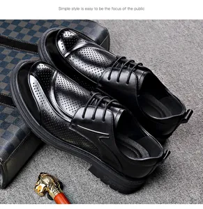 Detailed macro view of black perforated breathable men's business casual shoes with thick soles