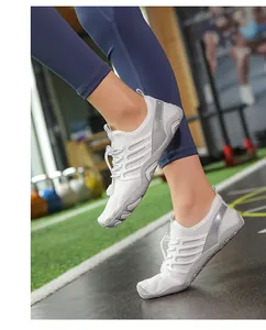 Detail of white barefoot water shoes with breathable mesh for yoga and fitness training