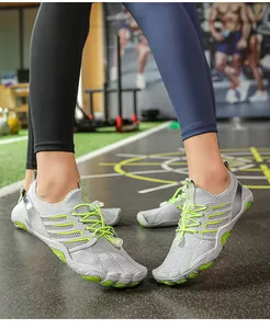 Close-up detail of grey and lime green non-slip water shoes for swimming and yoga fitness