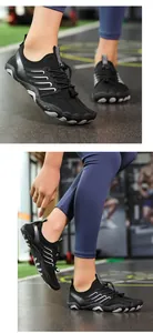 Close-up detail of black breathable water shoes for swimming and yoga fitness