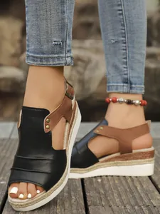 Close-up detail of peep toe design and jute rope espadrille platform on wedge sandals