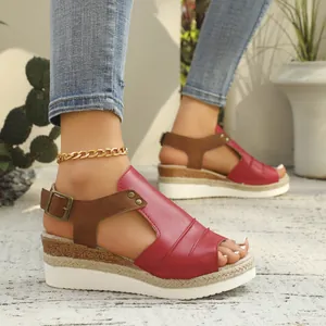 Stylish women's red wedge sandals featuring espadrille jute platform and peep toe design.